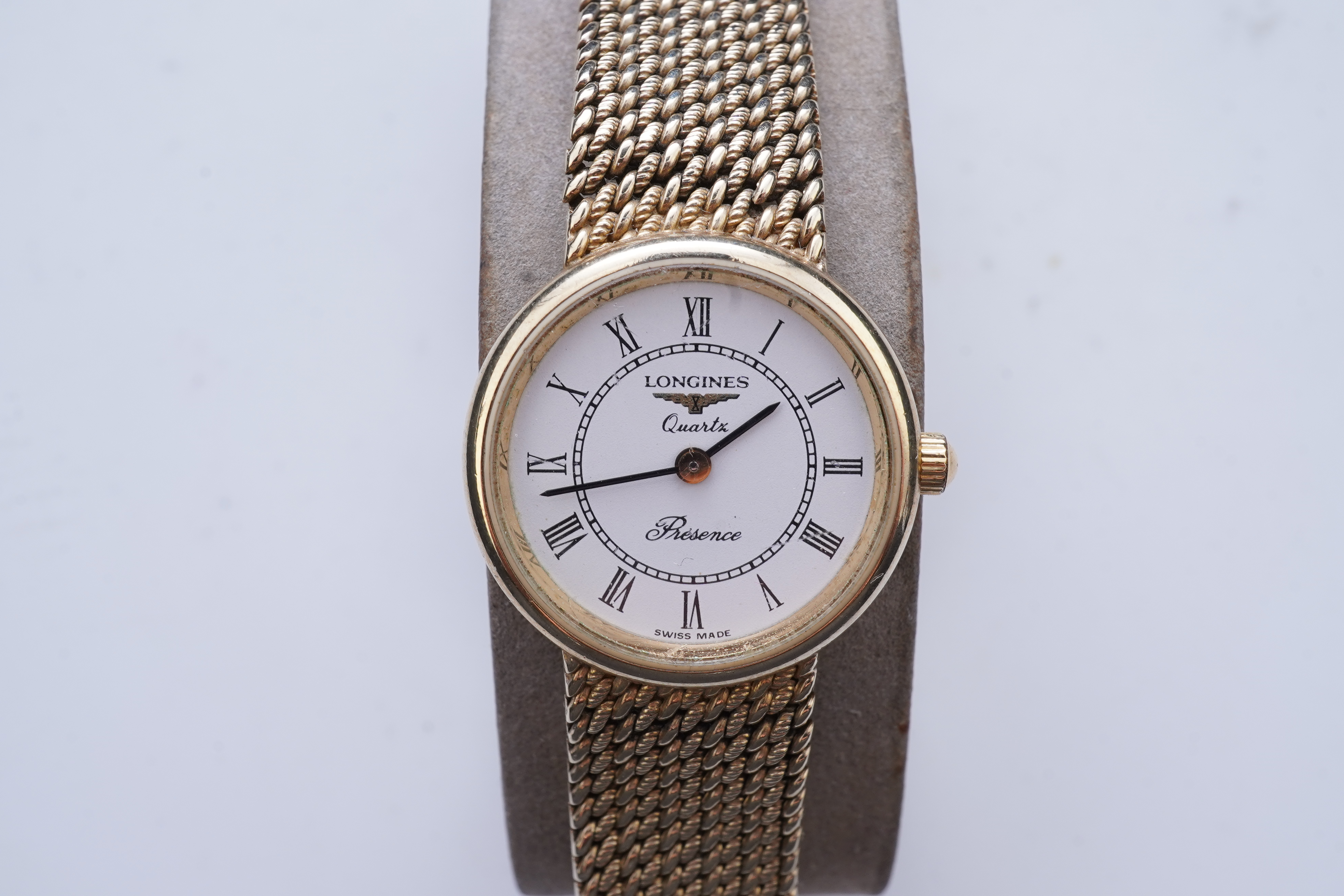 Longines, a gold watch